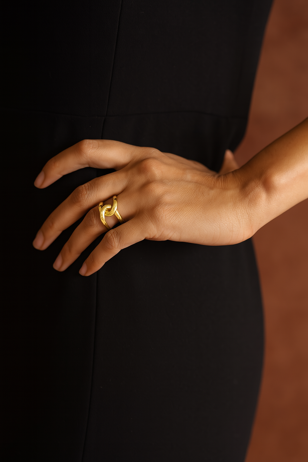Gold-filled sculptural statement ring on model’s hand