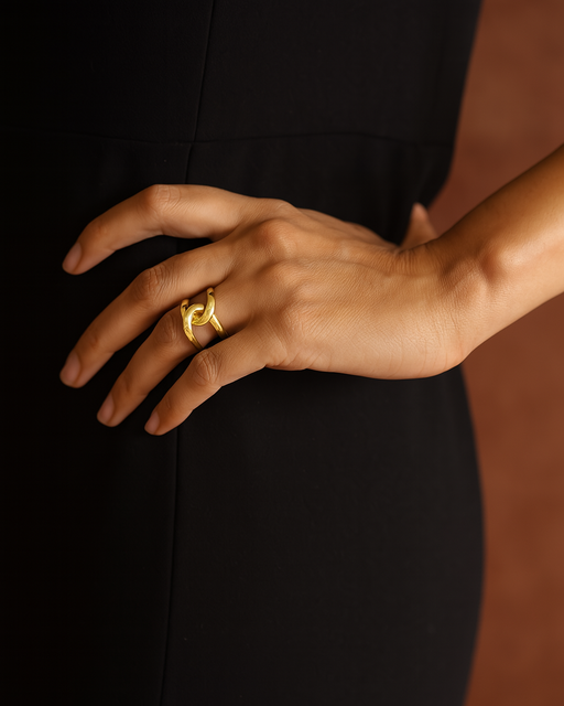 Gold-filled sculptural statement ring on model’s hand