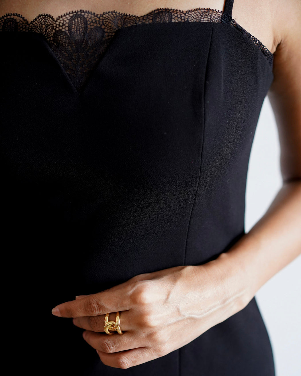 Gold-filled sculptural statement ring on model’s hand