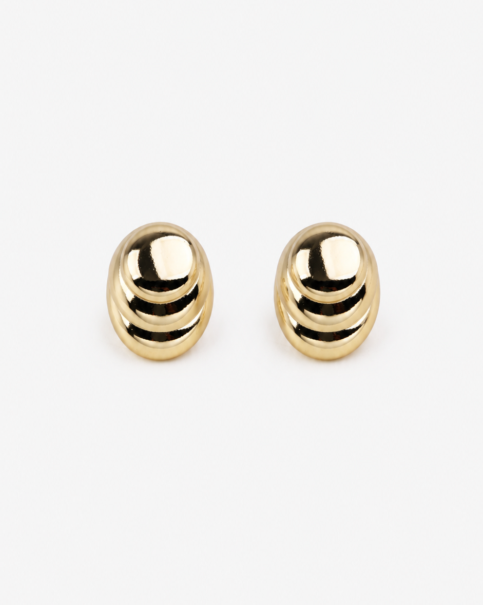 Pair of gold earrings on a white background