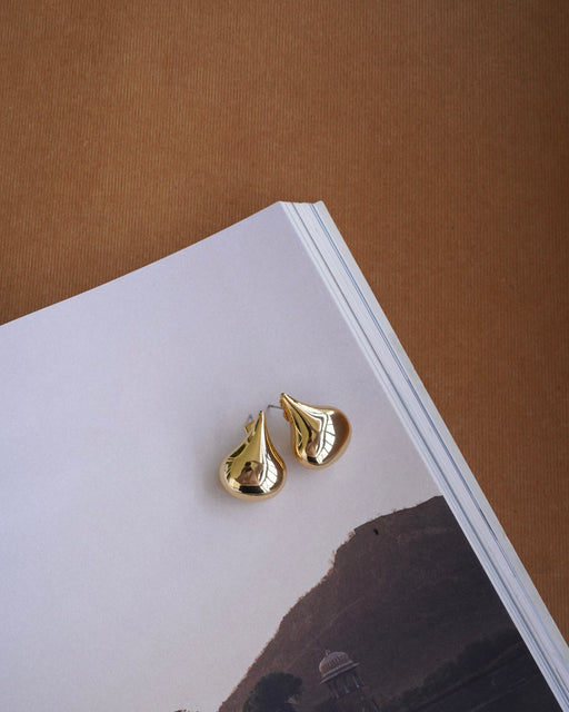 Close-up of sculptural stud earrings