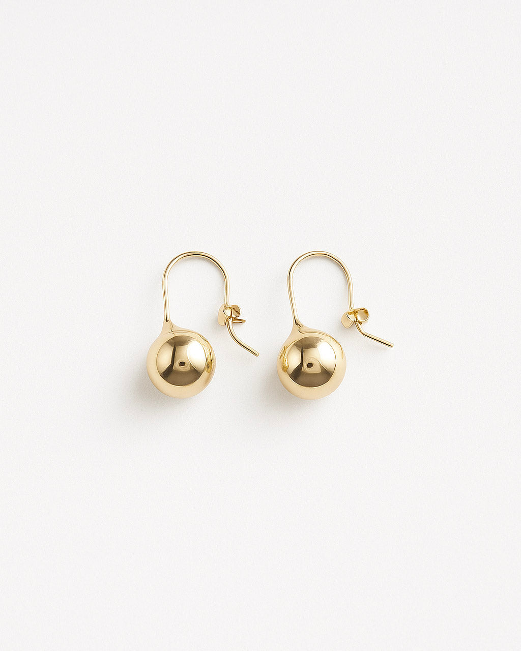 Iris Droplet Earrings – Minimalist gold teardrop earrings in 18K gold-filled brass on white background