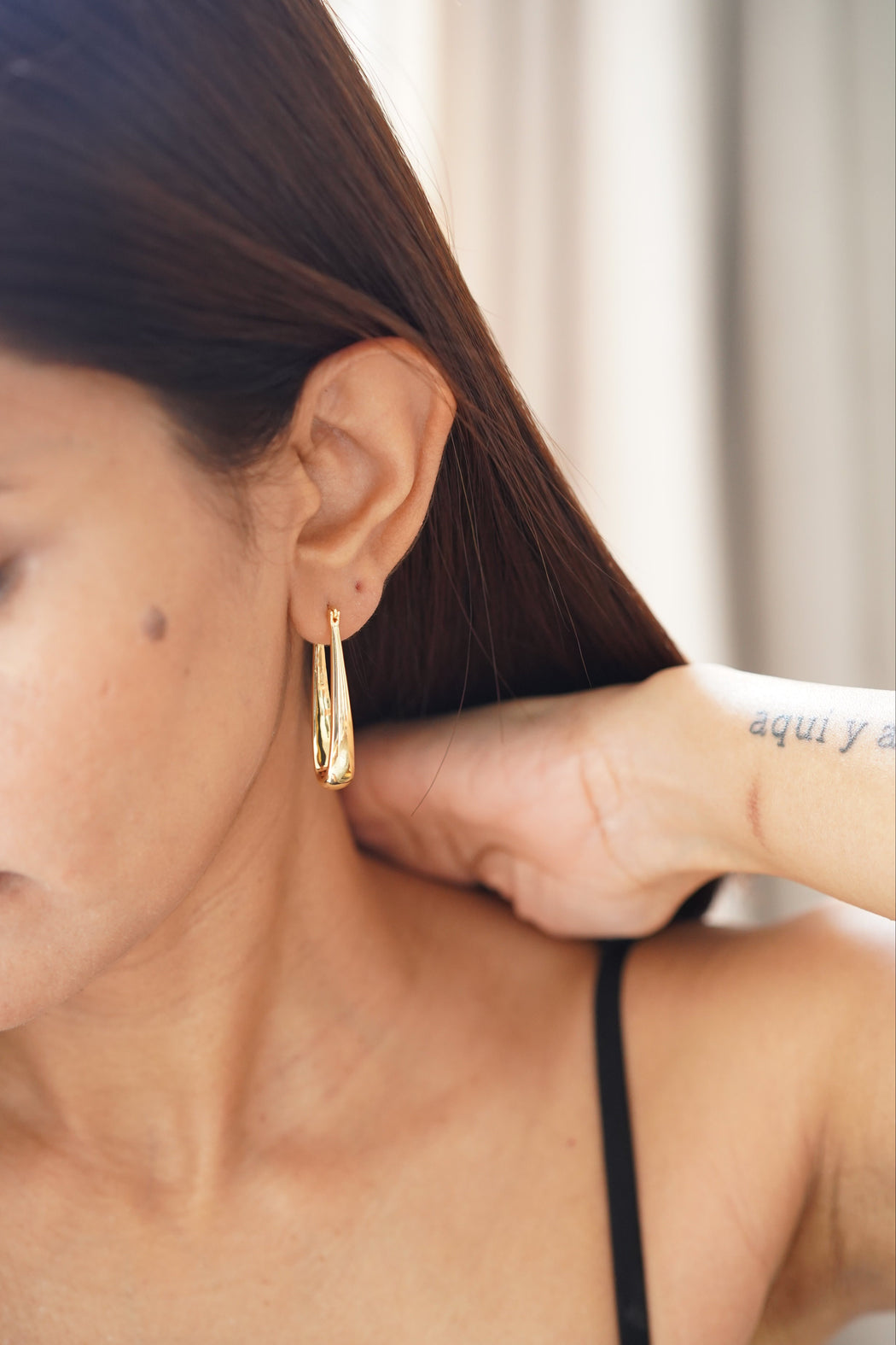 Statement gold hoop earrings for day-to-night wear