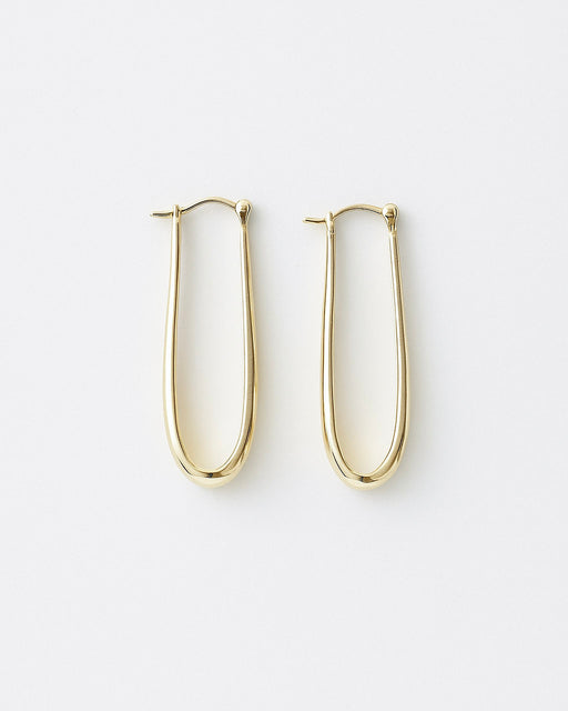 Close-up of Layla gold-filled statement hoops with high-polish finish