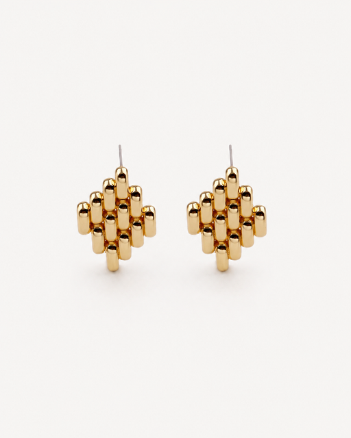 Gold geometric earrings on a white background