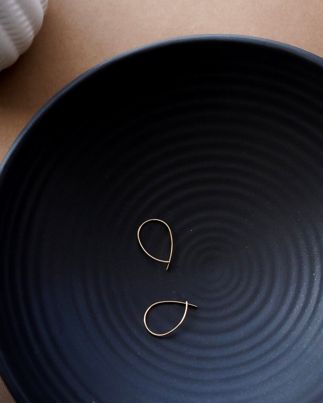 Amelia gold threader earrings flat lay